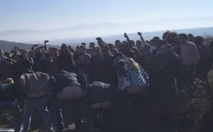Protesters moon the Russian militaries who erected a barbed wire fence in Atotsi in occupied South Ossetia