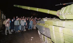 Lithuanian citizens attempt to block a Soviet tank near the national broadcaster in Vilnius on January 13, 1991. That night, Soviet forces killed 13 people, intimidated international journalists and blocked the radio and TV signal. People also gathered around the Parliament, where Vytautas Landsbergis was working on a political solution to the aggression, to defend it from a potential attack.